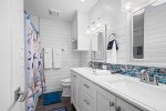 En-suite master bathroom with double vanity and walk in shower